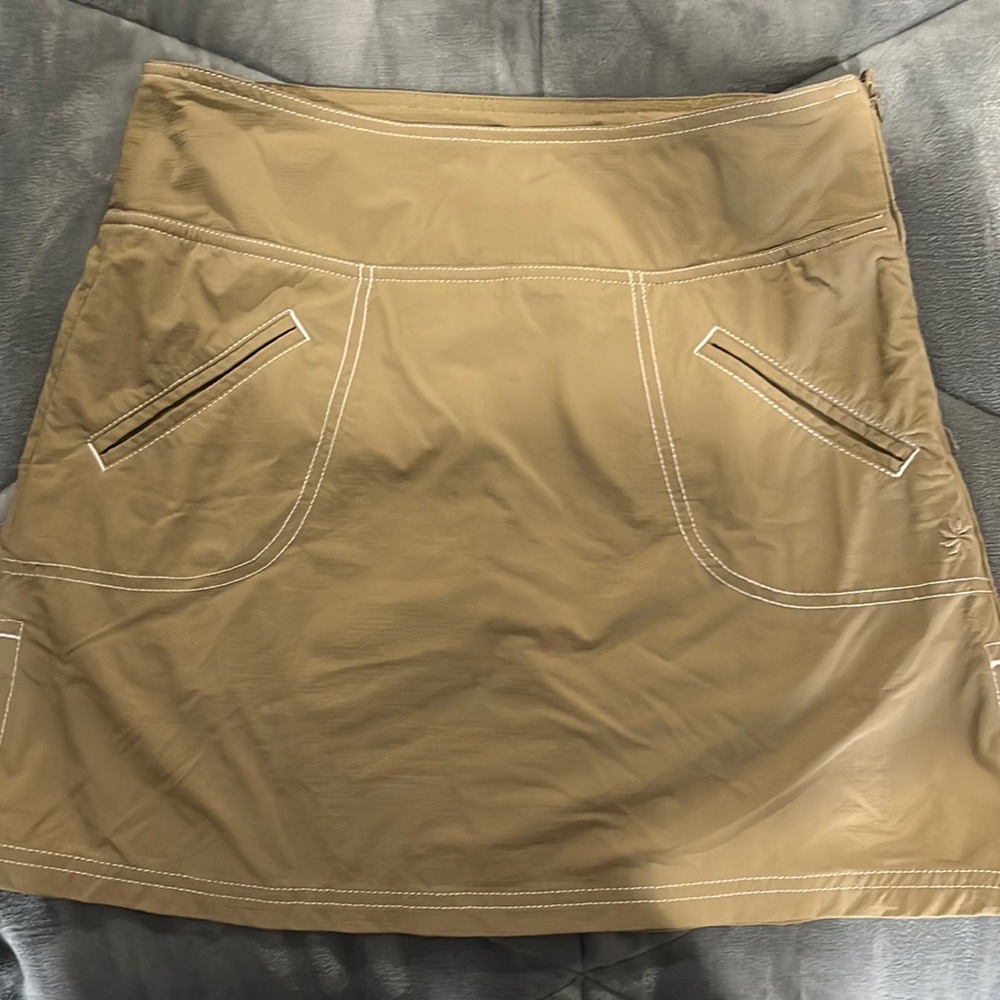 Women’s Athleta skort.  Size 2. Tan with white stitching.  Good condition